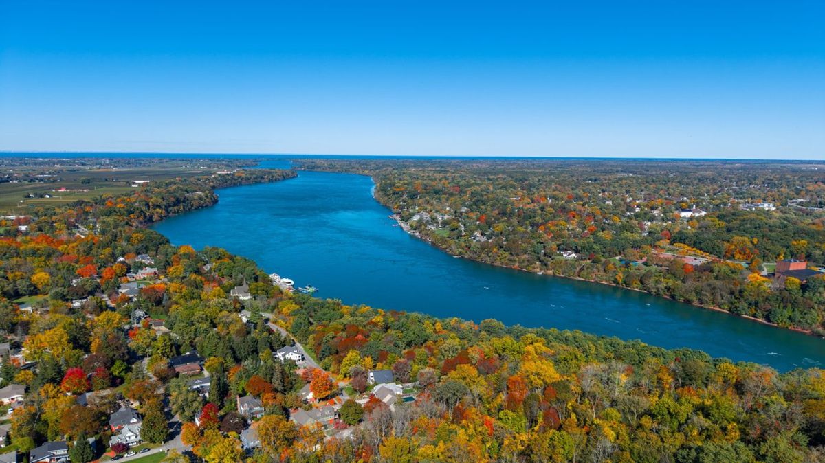 A wide river through fall colors in Ontario