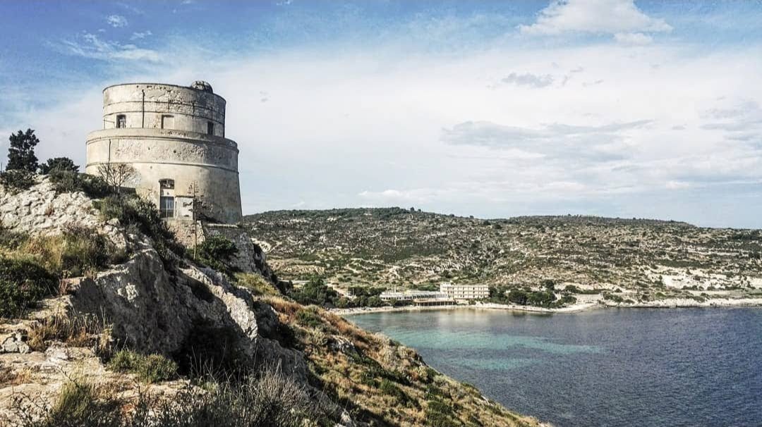 An old coastal tower and a cove near Cagliari