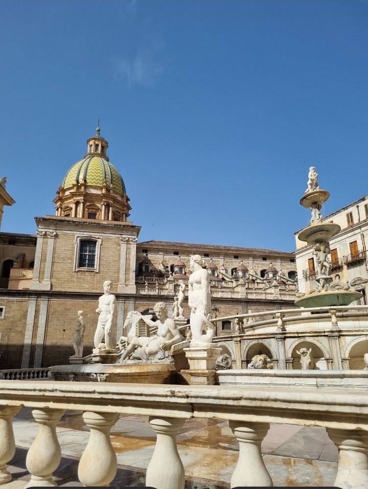 The Piazza Pretoria fountain and the dome of Santa Caterina
