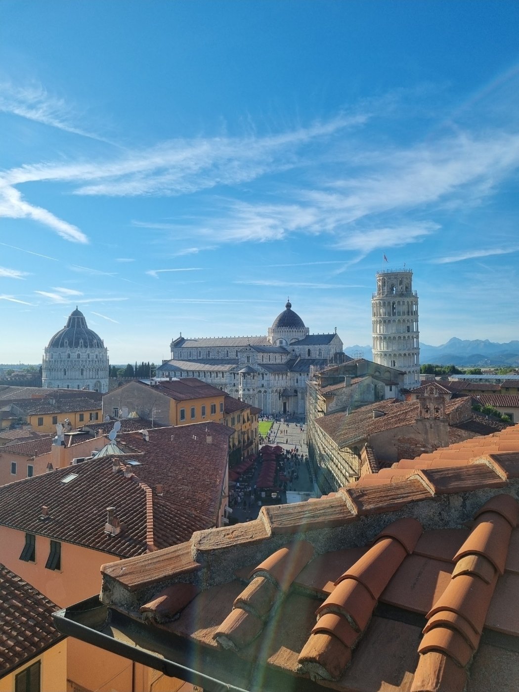 Pisa: the Leaning Tower, cathedral and baptistery from a rooftop terrace, no lines.