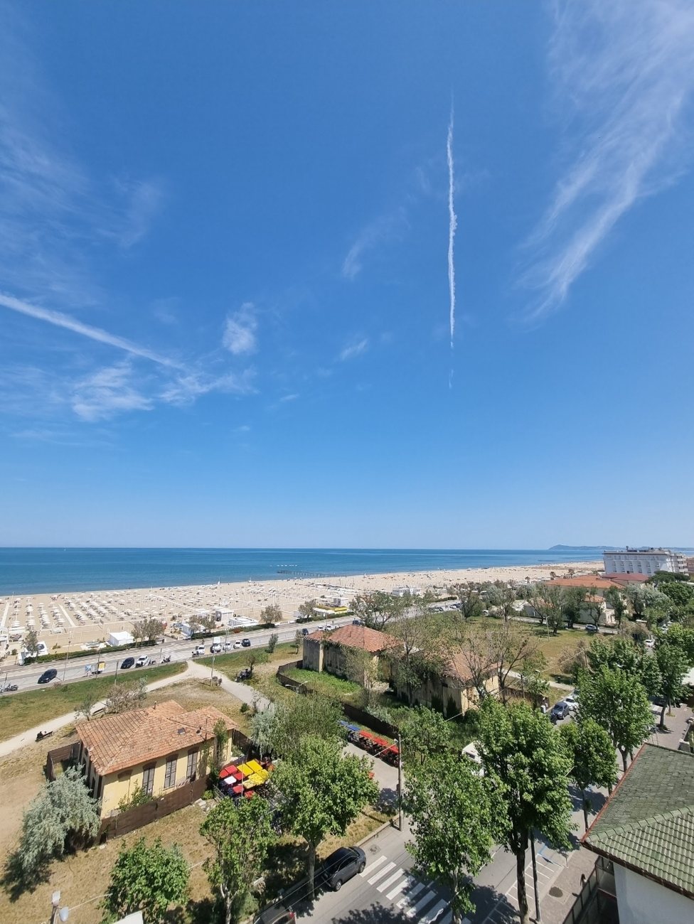 Rimini’s long sandy beach and rows of umbrellas from above