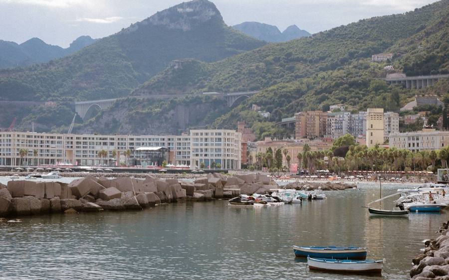 Salerno: the waterfront and port, with the Amalfi Coast mountains behind.